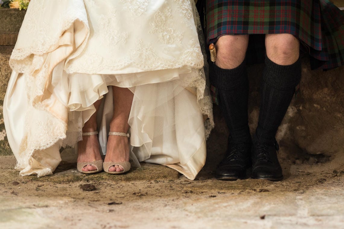 bride and groom photo of their feet and shoes