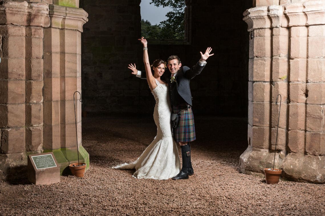 Caroline and Graham newlyweds at Dunglass Collegiate Church