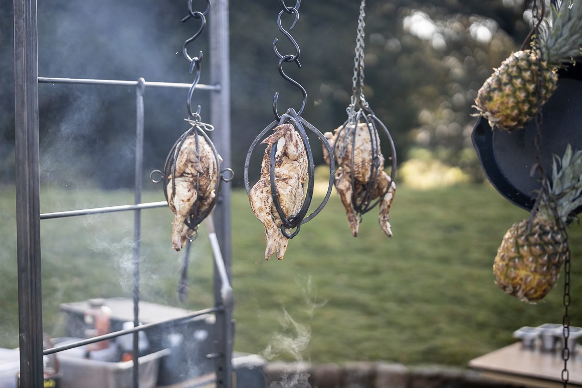 Fire Pit - chickens cooking over the barbeque