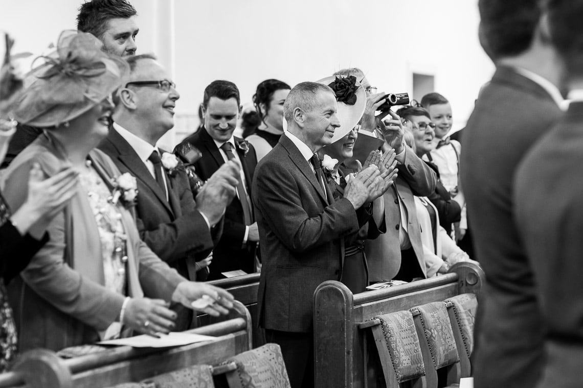 guests applaud the newlyweds at Liberton Kirk