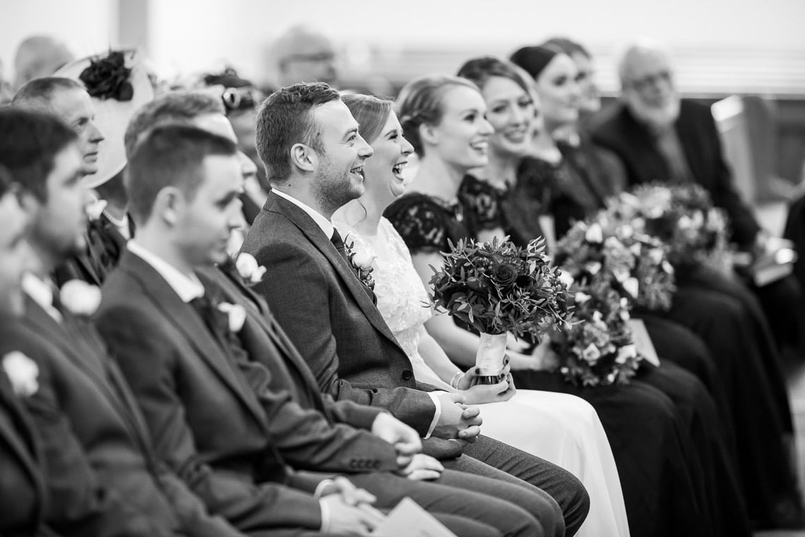 bride and groom enjoying the sermon during ceremony at Liberton Kirk
