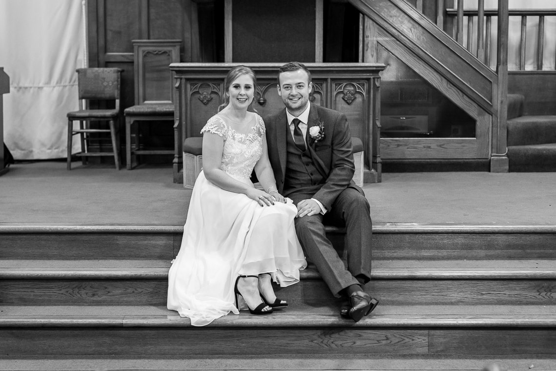 newlyweds sitting on the altar at Liberton Kirk