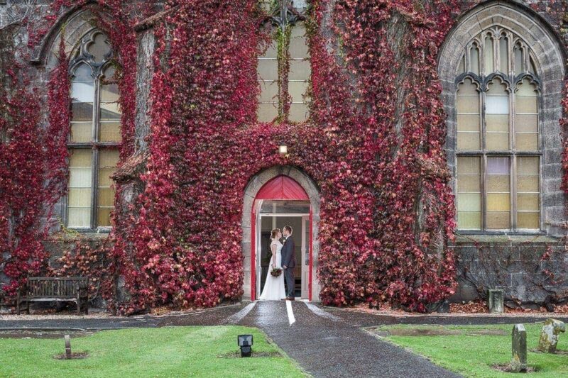 Liberton Kirk wedding photographer image of Lynn and Alex at the door of Liberton Kirk.
