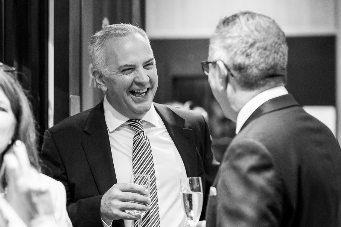 George Hotel Library champagne reception guests laughing