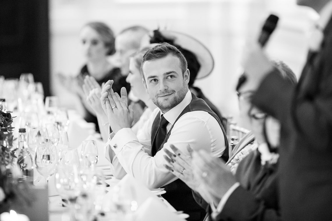 groom applauds the best man