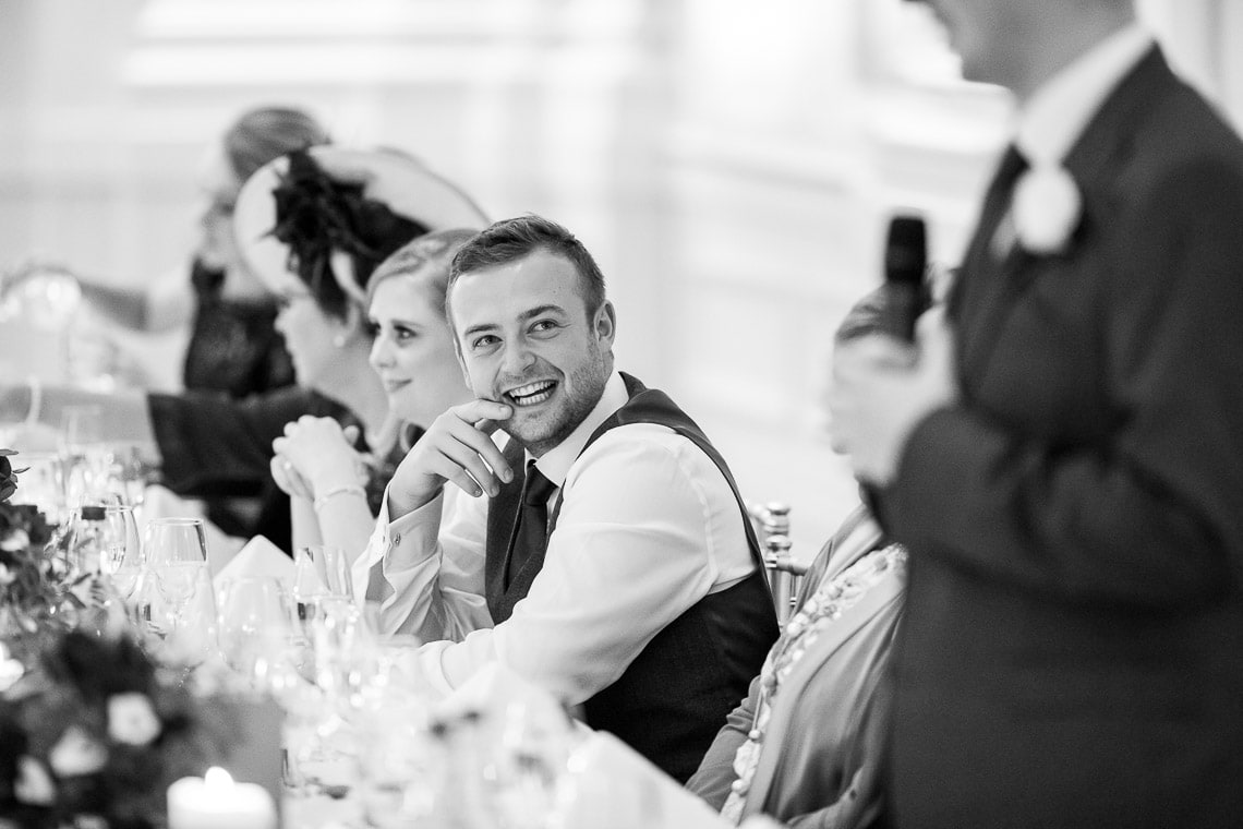 groom laughing at groom's speech in the King's Hall