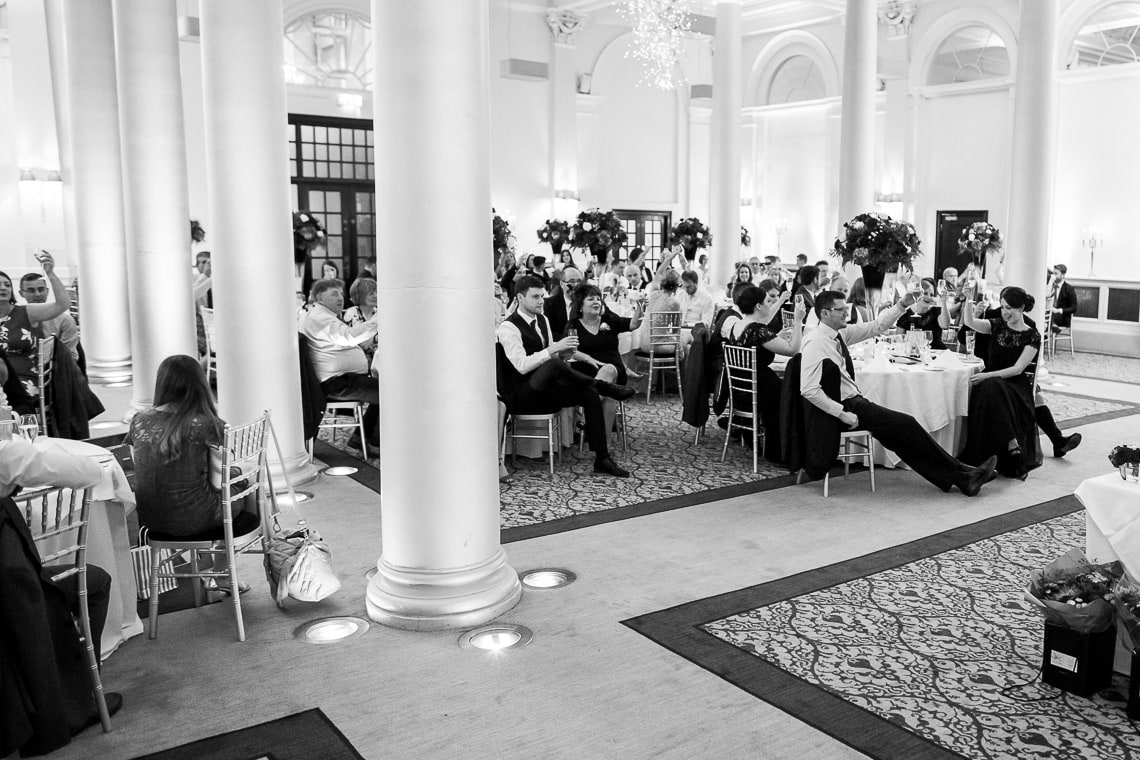 guests raise a toast at the end of groom's speech in the King's Hall
