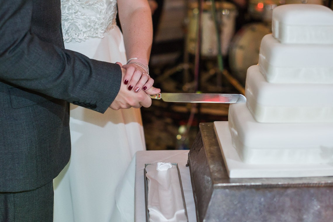 newlyweds cutting the cake in the King's Hall
