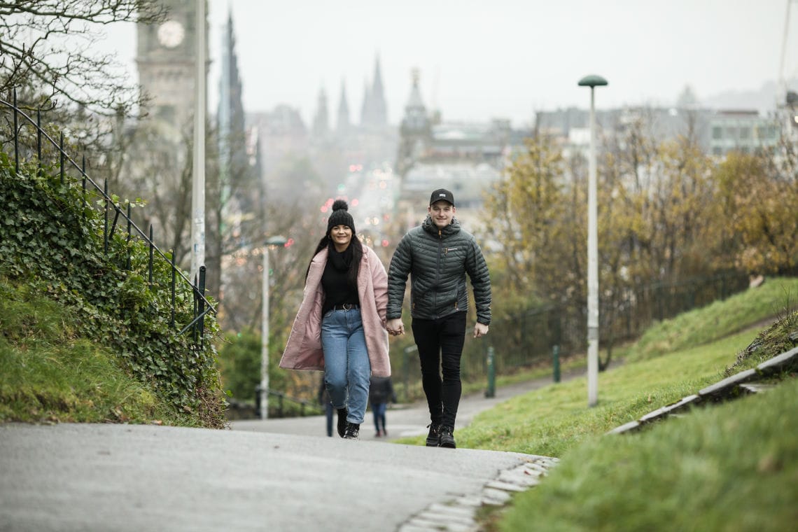 Jake and Kelly walking holding hands