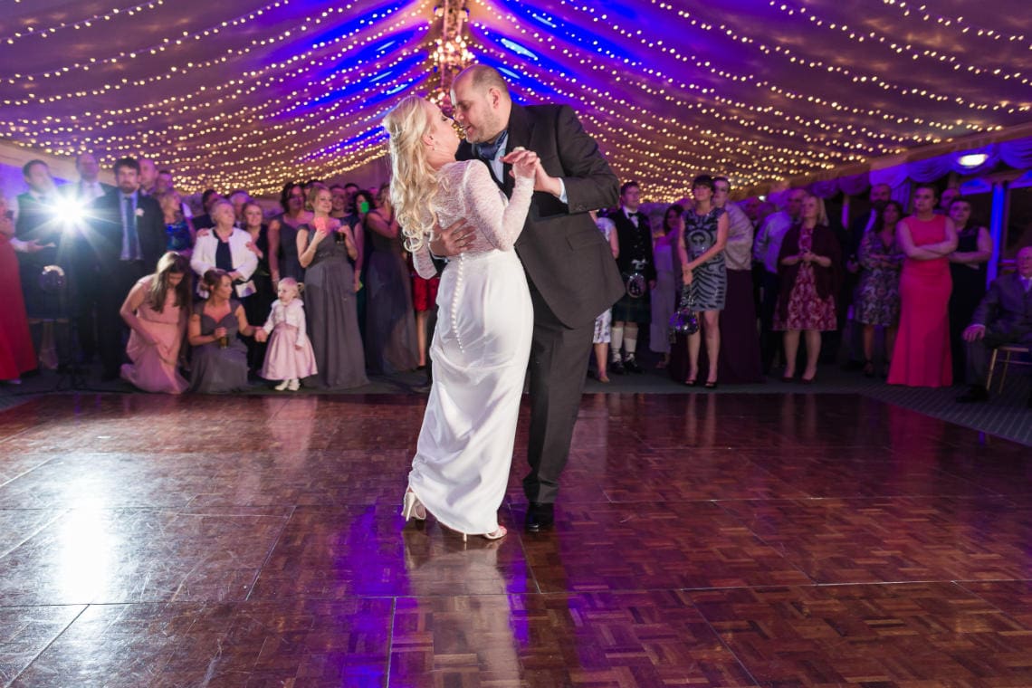 Pavilion newlyweds' first dance embrace