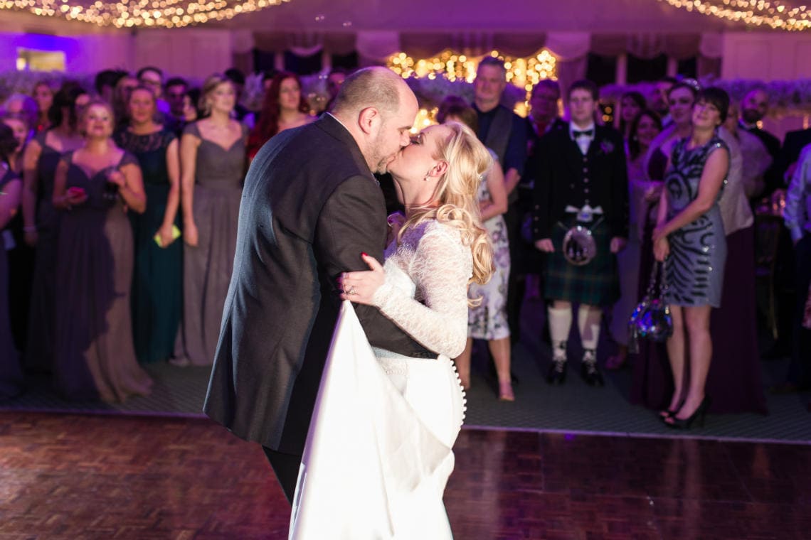 Pavilion newlyweds kissing