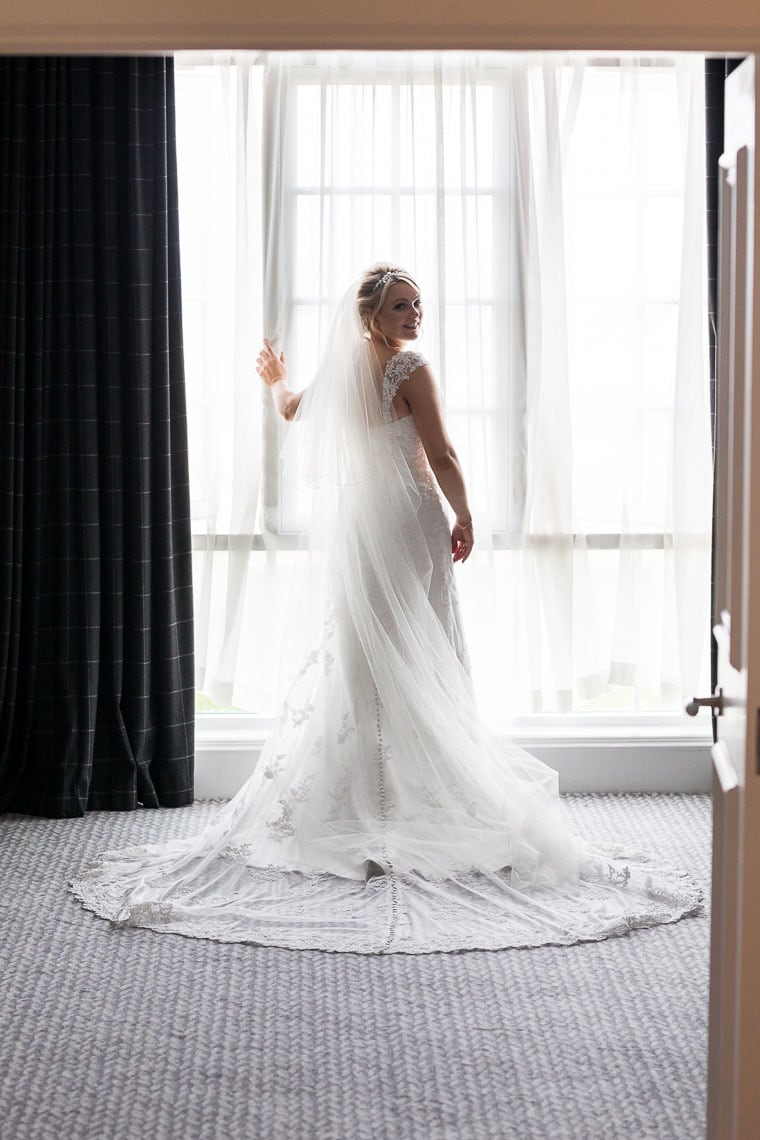 bride back of dress looking back over her shoulder