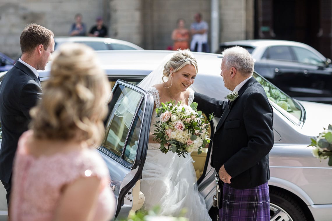 bride exits a Bentley