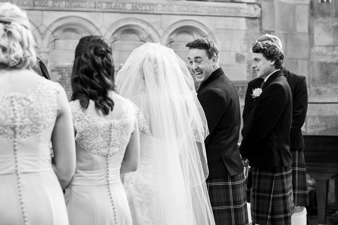groom smiling at his bride