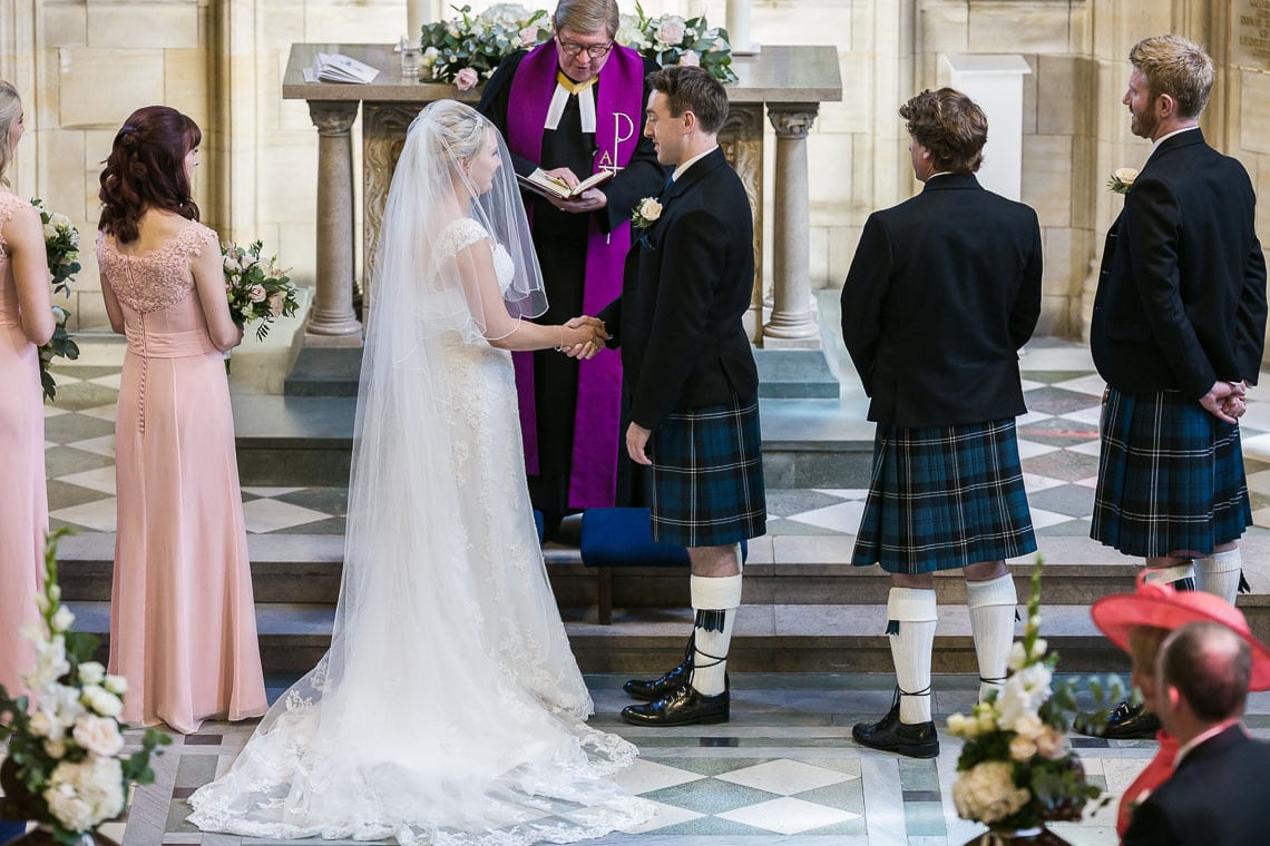 bride and groom exchange vows