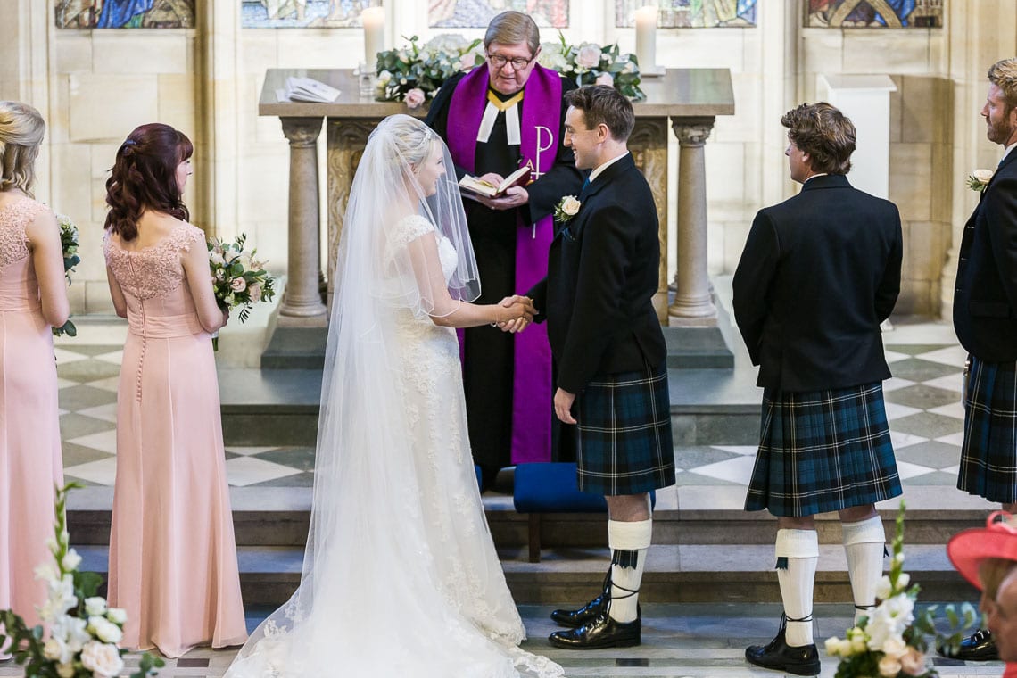 bride and groom exchange vows
