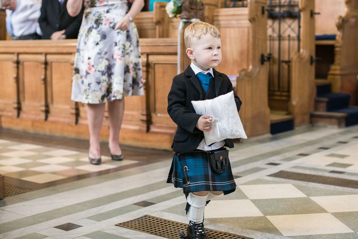 page boy bringing the wedding rings