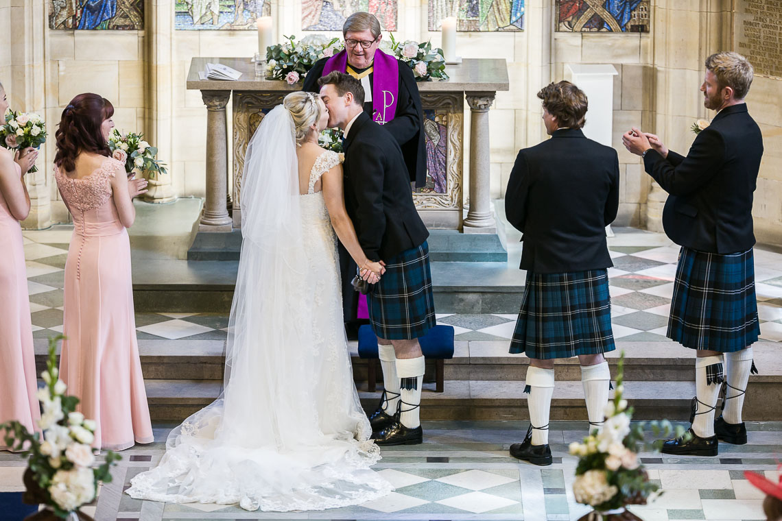 newlyweds' first kiss at St Salvator's Chapel, view from the organ balcony