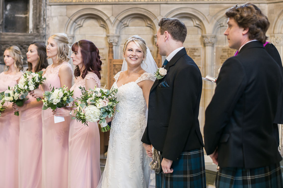 newlyweds smile at each other