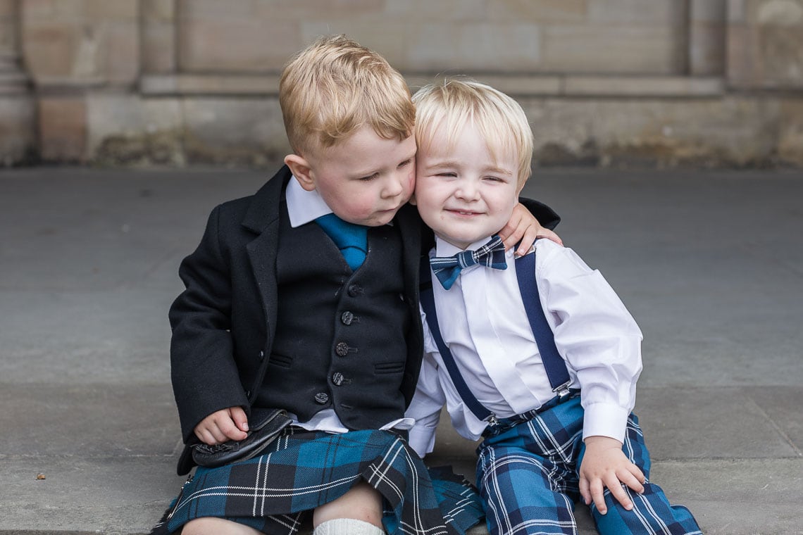 two little boys sitting on the steps at St Salvator's Chapel