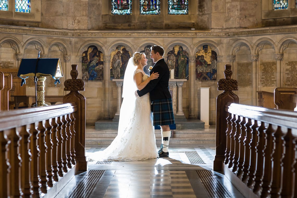 newlywed photo standing on the altar at St Salvator's Chapel
