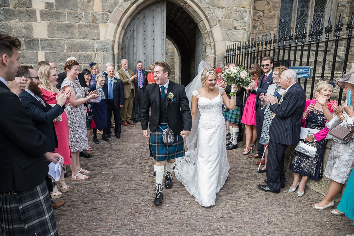 newlyweds departing St Salvator's Chapel