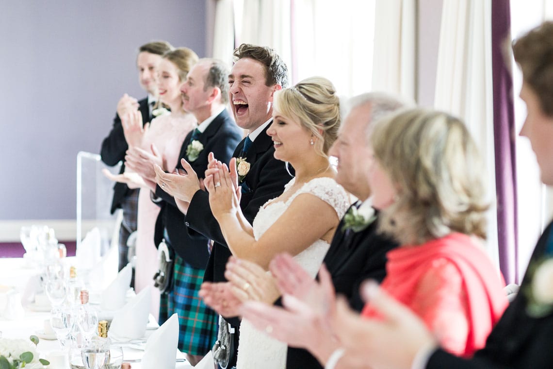 Robert Louis Stevenson Suite piper toast to the newlyweds who are cheering