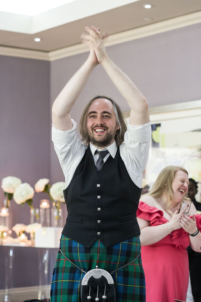 Robert Louis Stevenson Suite piper toast to the newlyweds, guest is cheering