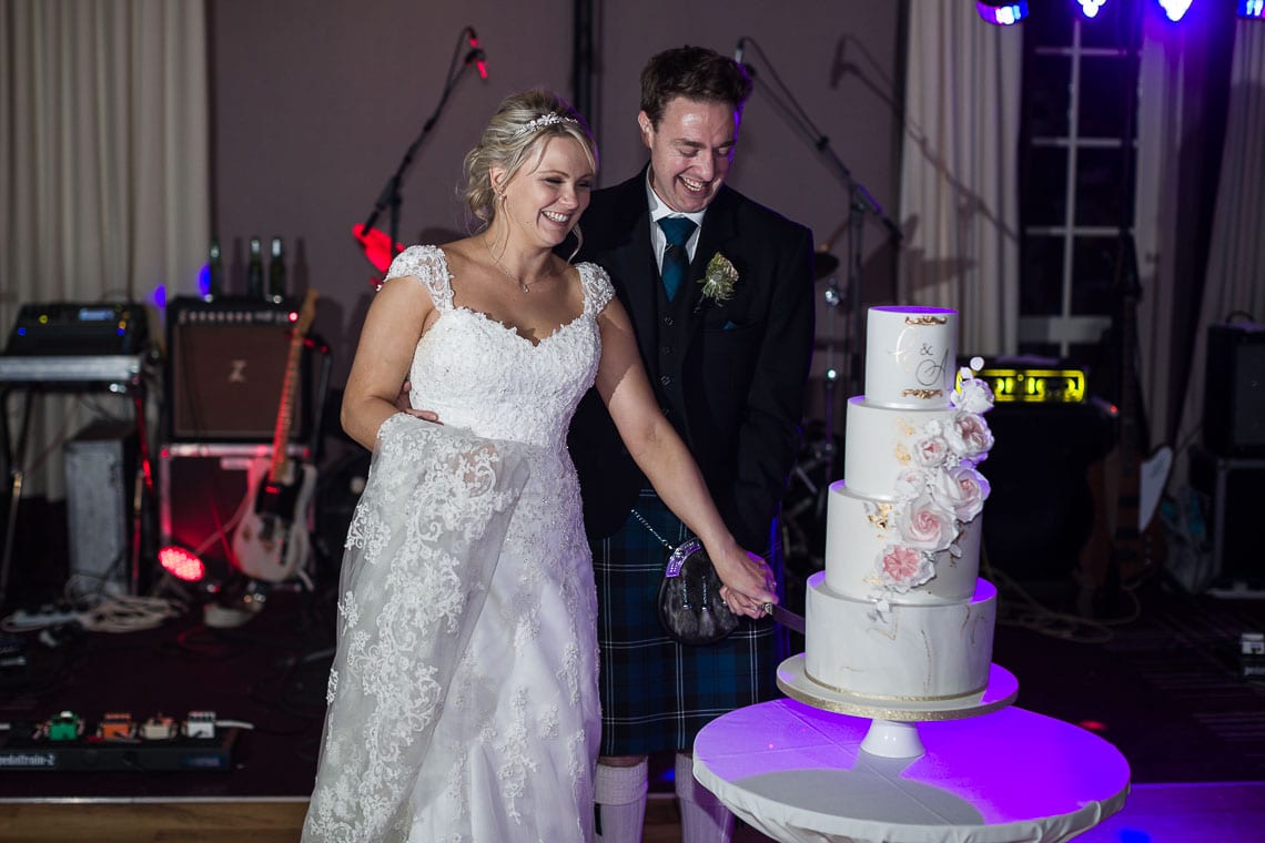 Robert Louis Stevenson Suite newlyweds cut the cake