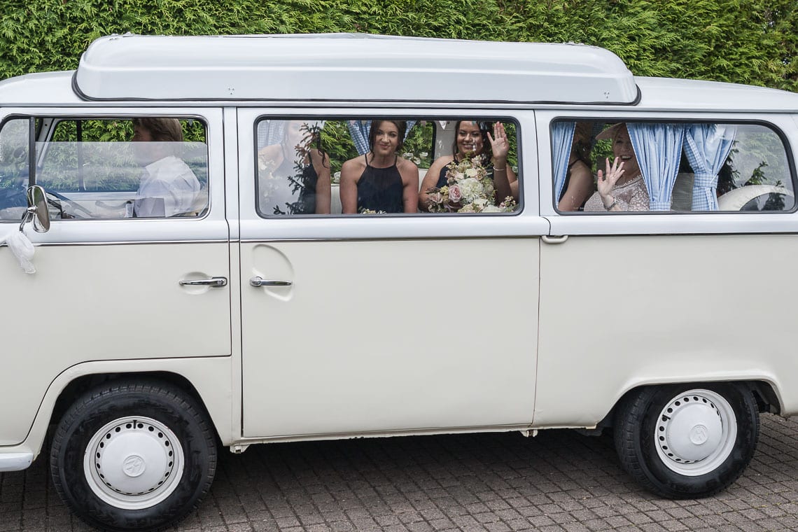 bridal party arrive in a classic VW camper van