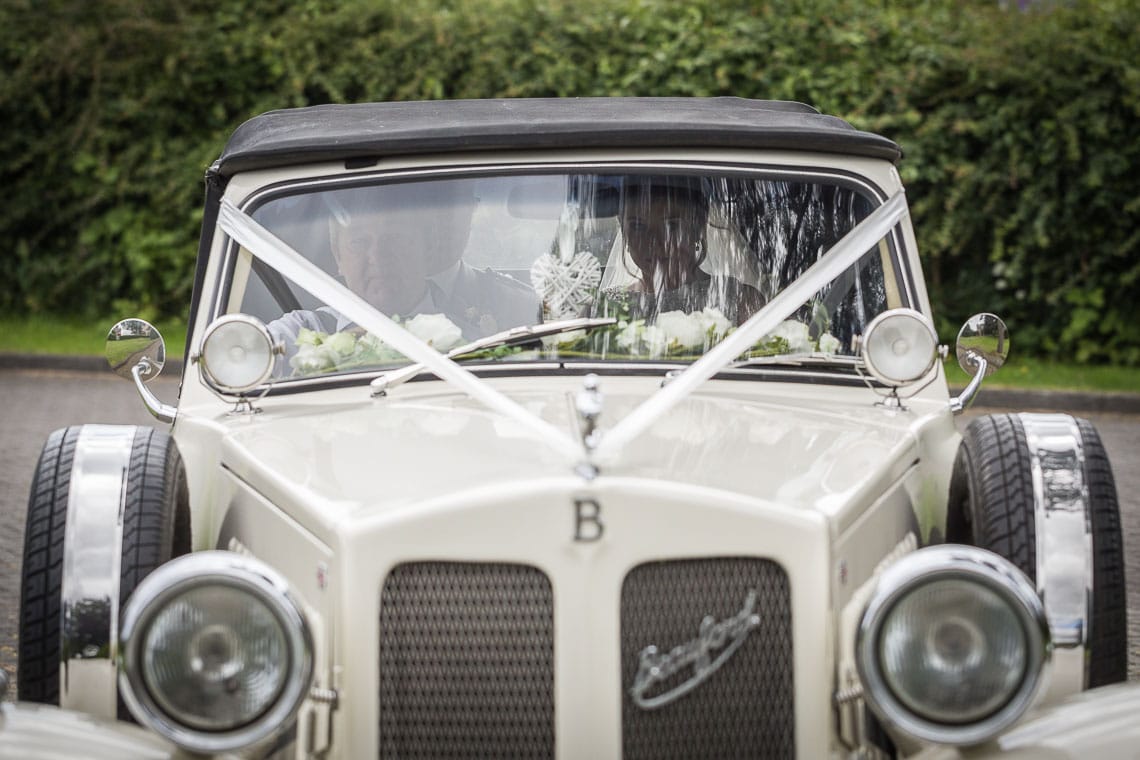 bride arrives in a Beauford car