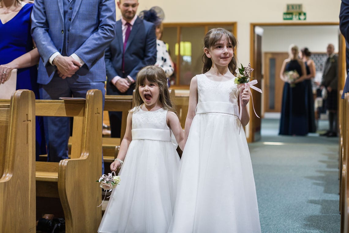 flower girls walking up the aisle