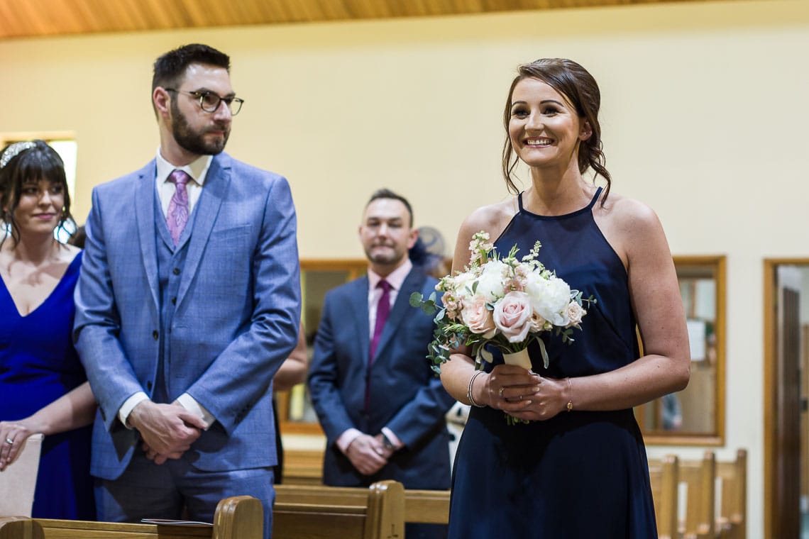 bridesmaid walking up the aisle