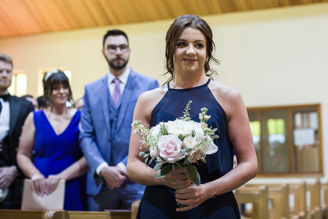 bridesmaid walking up the aisle