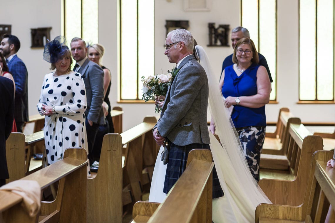 bride and father walking up the aisle