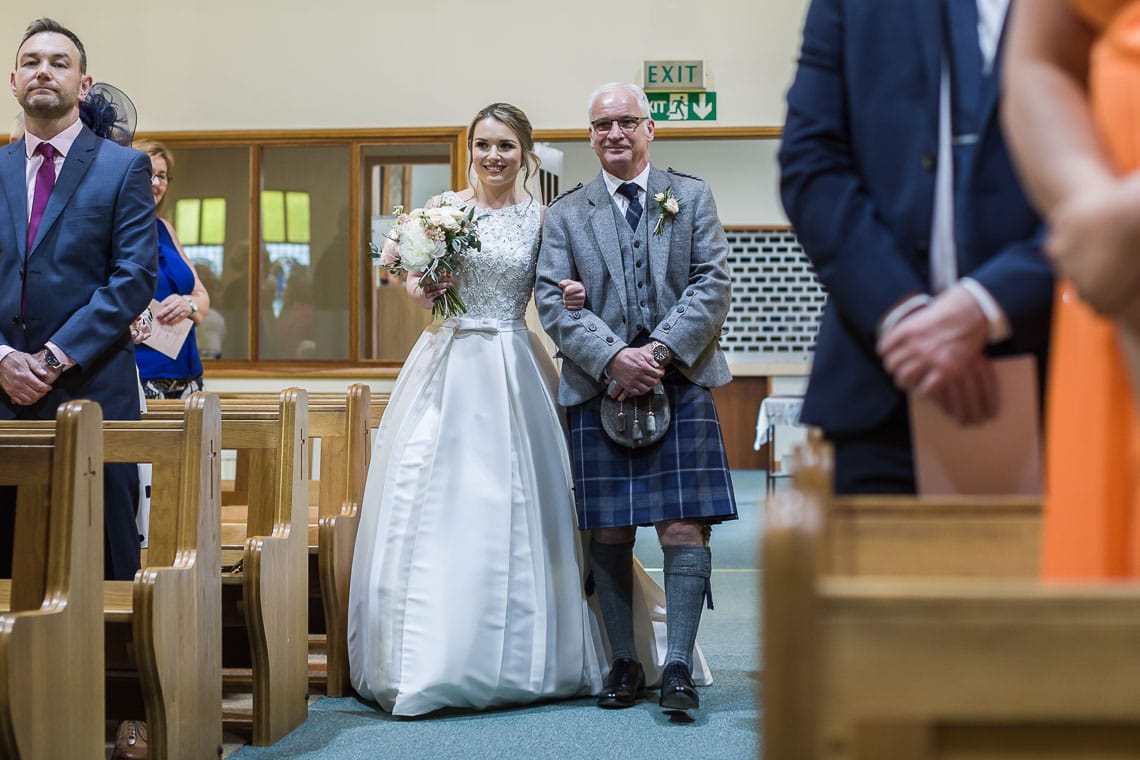 bride and father walking up the aisle