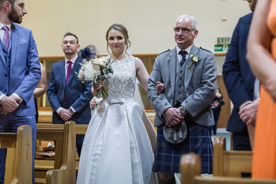 bride and father walking up the aisle