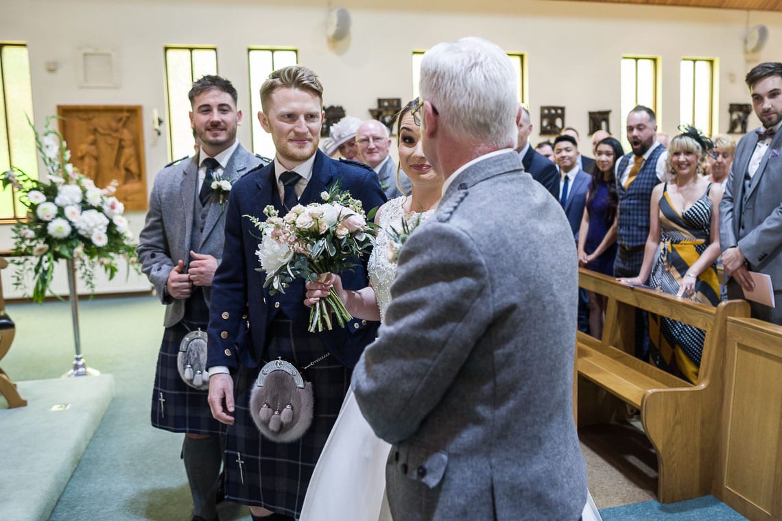 bride and father walking up the aisle