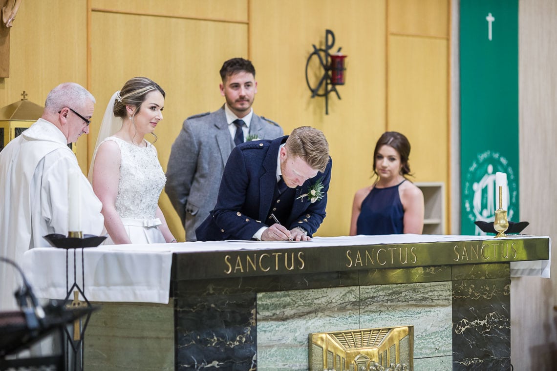 groom signs the marriage schedule