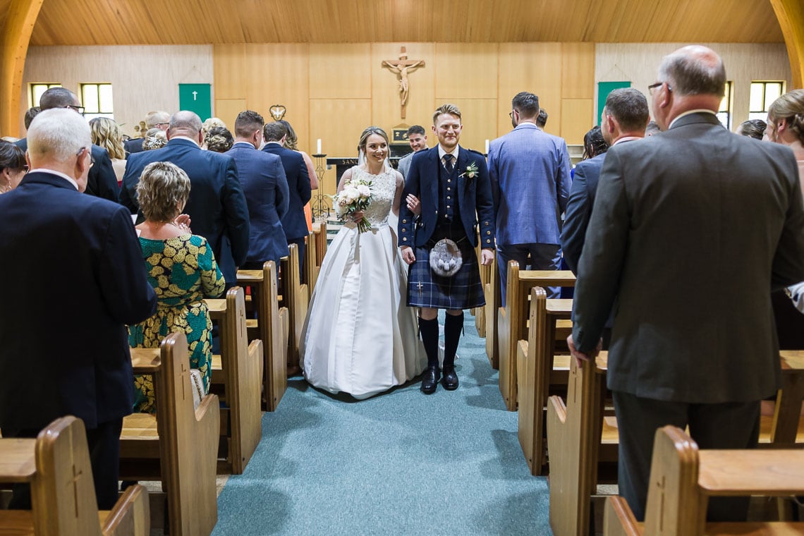 recessional newlyweds walking up the aisle
