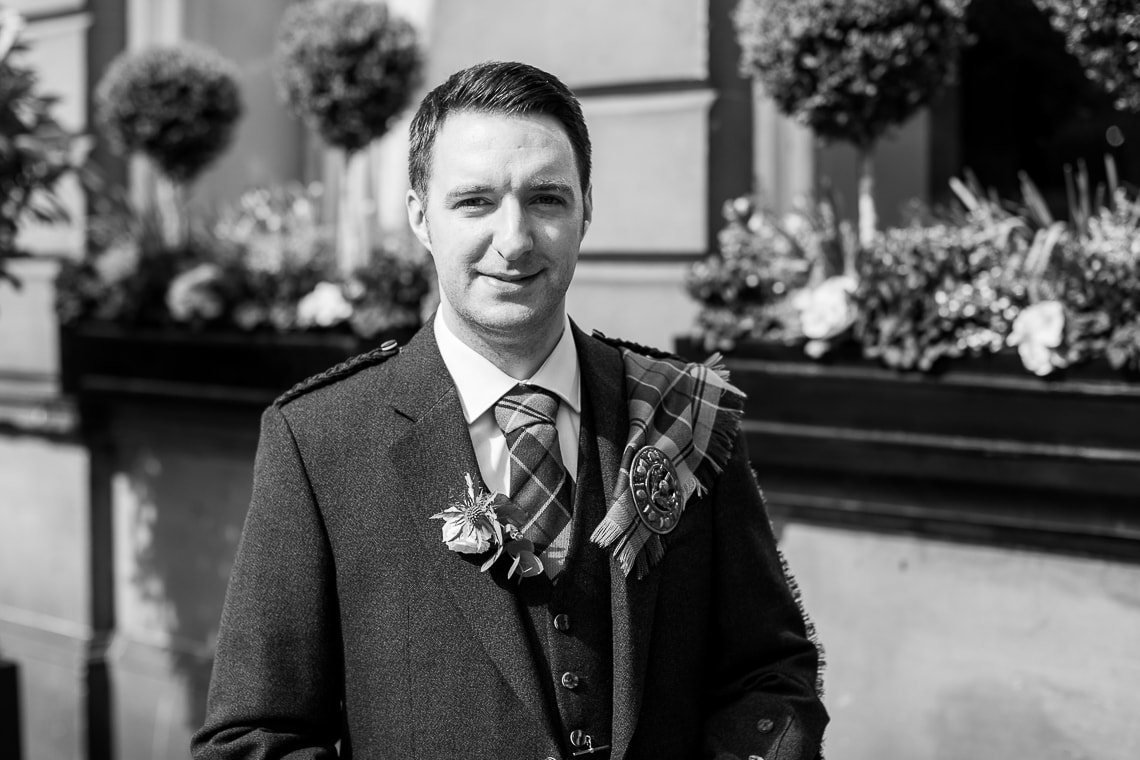 groom standing on George Street