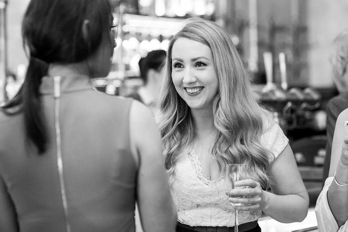 guests enjoying a pre-ceremony drink at the bar