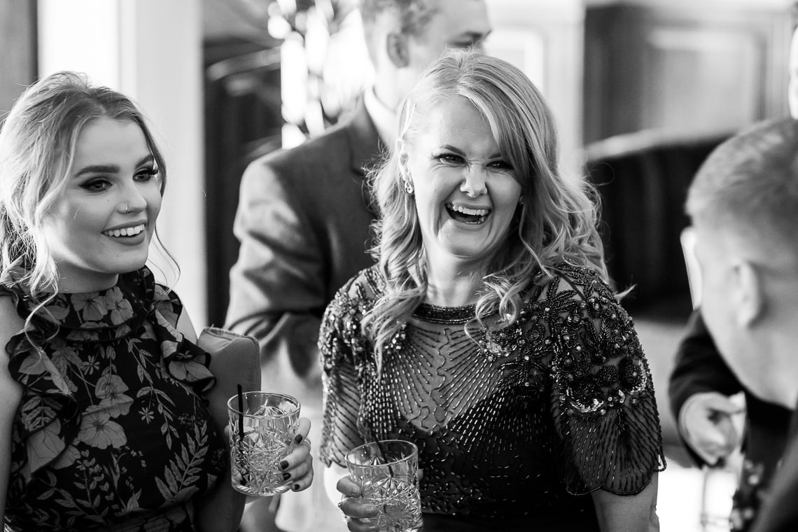guests enjoying a pre-ceremony drink at the bar