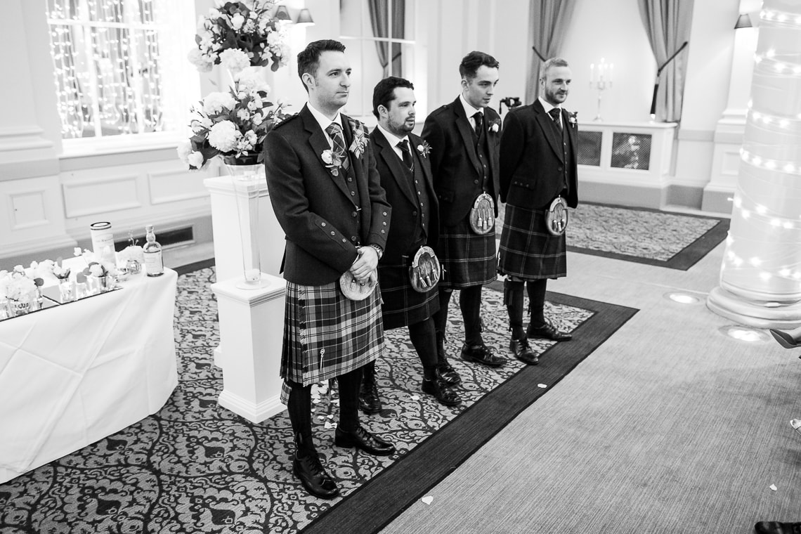 groom and groomsmen waiting for the arrival of the bride in the Kings Hall