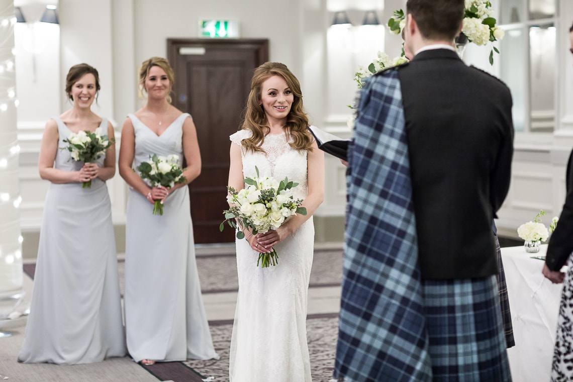 bride listening to the celebrant during Humanist ceremony in the King's Hall