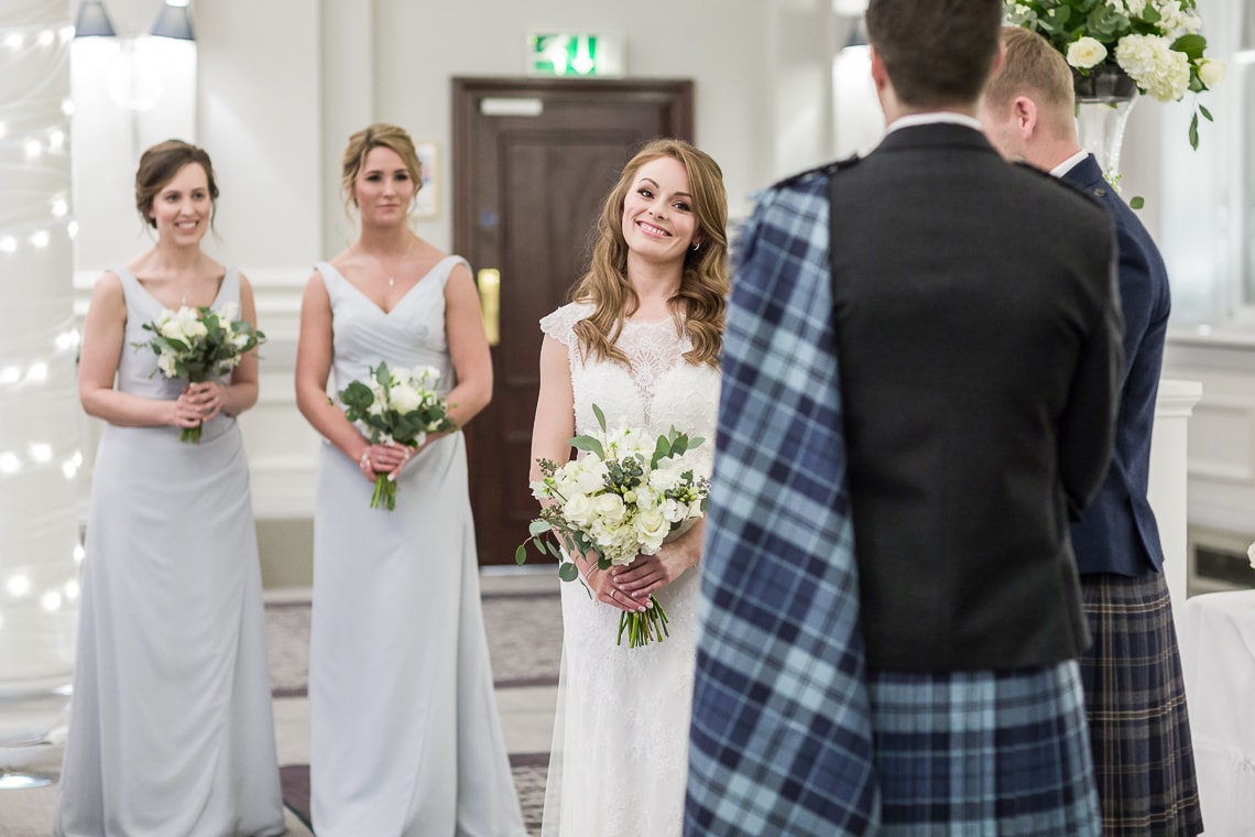 bride listening to the celebrant during Humanist ceremony in the King's Hall