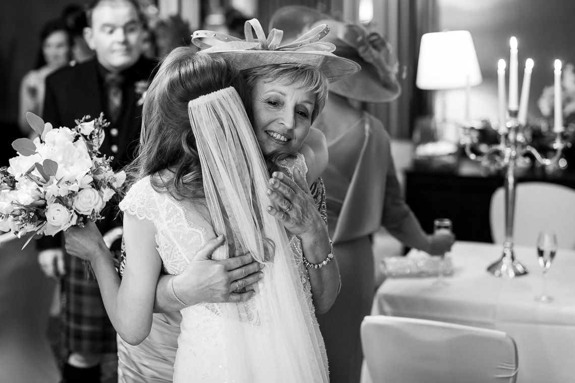 guest congratulating bride in the Library