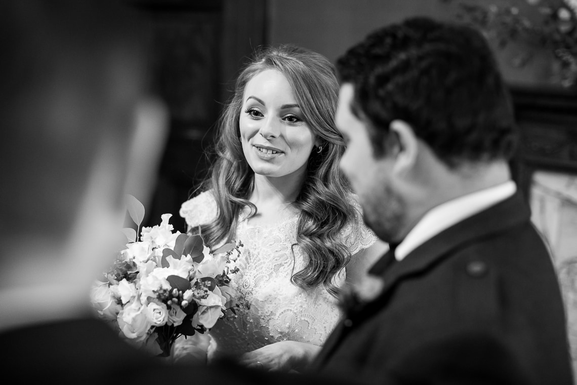 bride chats with guests in the Library
