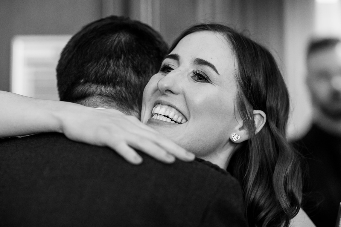 guest congratulating groom in the Library