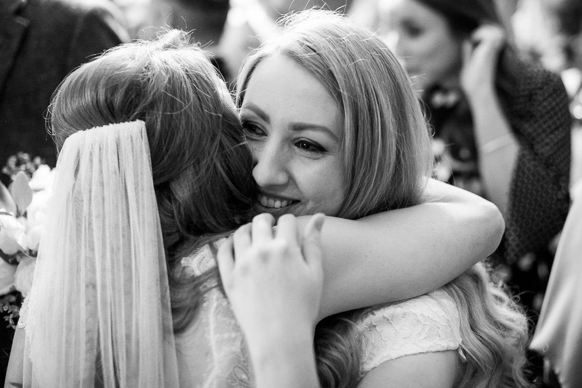 guest congratulating bride in the Library